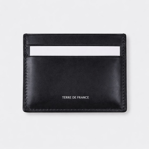 Porte-cartes cuir noir 5 emplacements — fermé sur fond gris, fabriqué en France